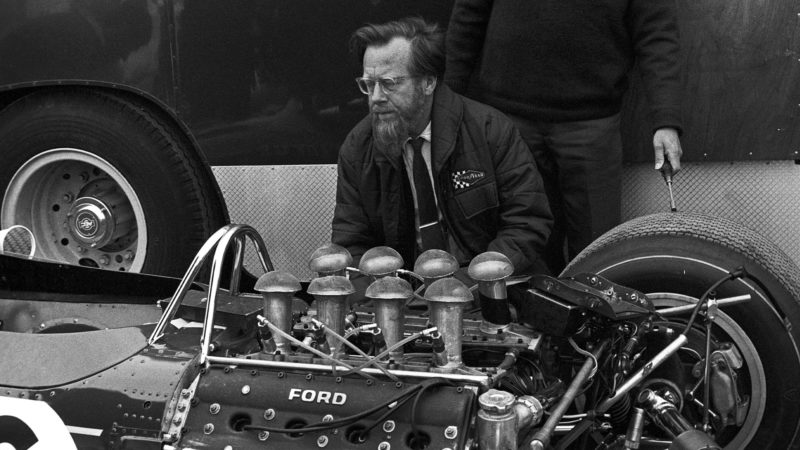 Denis Jenkinson, Grand Prix of the Netherlands, Circuit Park Zandvoort, 04 June 1967. Denis Jenkinson, journaliste extraordinaire, examining the btrand new Ford-Coswotrth DFV engine fitted on the Lotus 49. (Photo by Bernard Cahier/Getty Images)