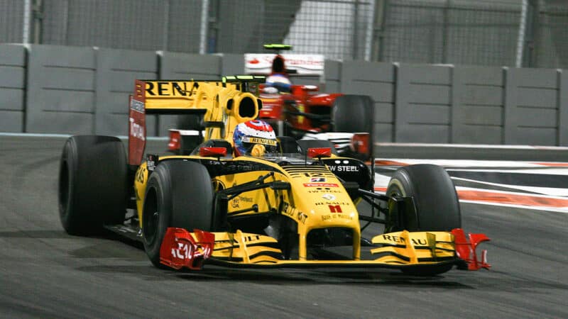 Vitaly Petrov ahead of Fernando Alonso at the 2010 Abu Dhabi Grand Prix