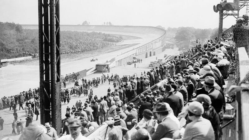 Spectators watch cars coming off the banking at 1931 French Grand Prix