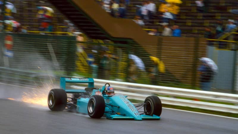 Sparks fly from the Leyton House of Ivan Capelli at the 1987 Austrian Grand Prix