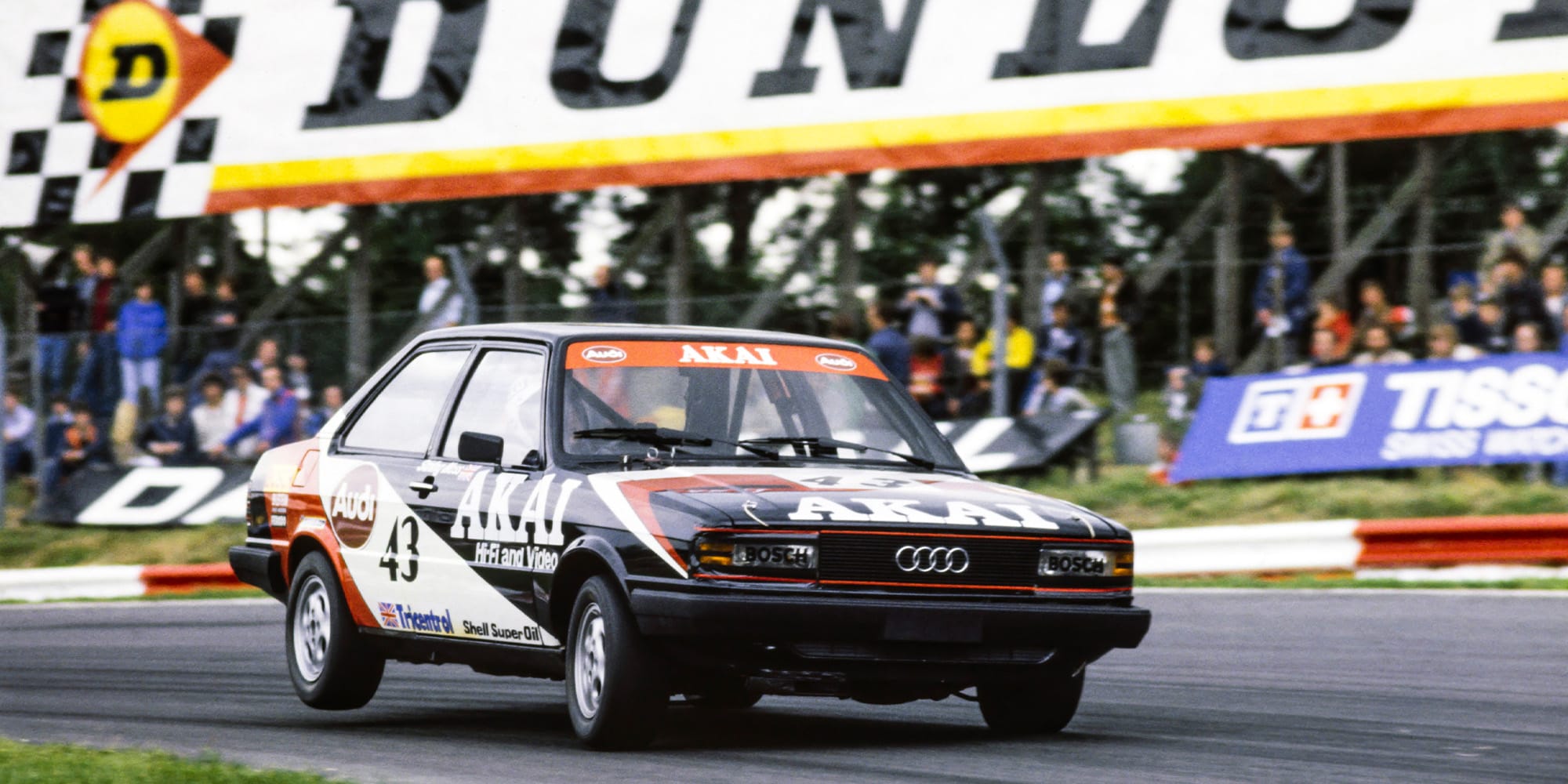 Stirling Moss' Audi lifts a wheel in the British Saloon Car Championship