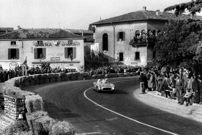Stirling Moss and Denis Jenkinson race through another Italian town 1955 Mille Miglia Italy