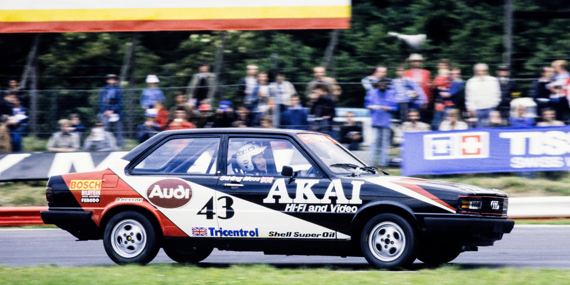 Stirling Moss behind the wheel of his Audi 80 in the British Saloon Car Championship