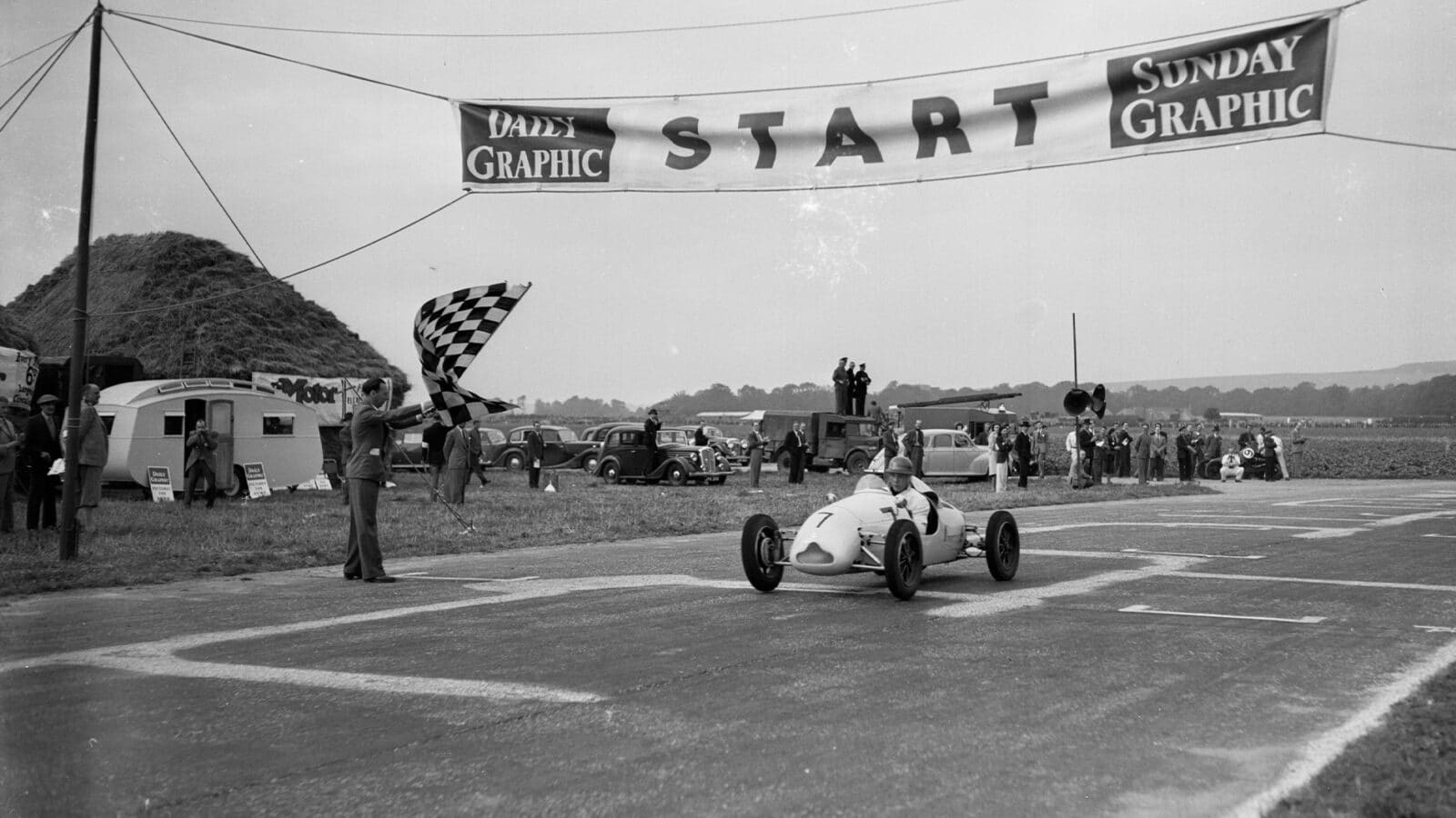 Stirling Moss crosses finish line to win first race at Goodwood