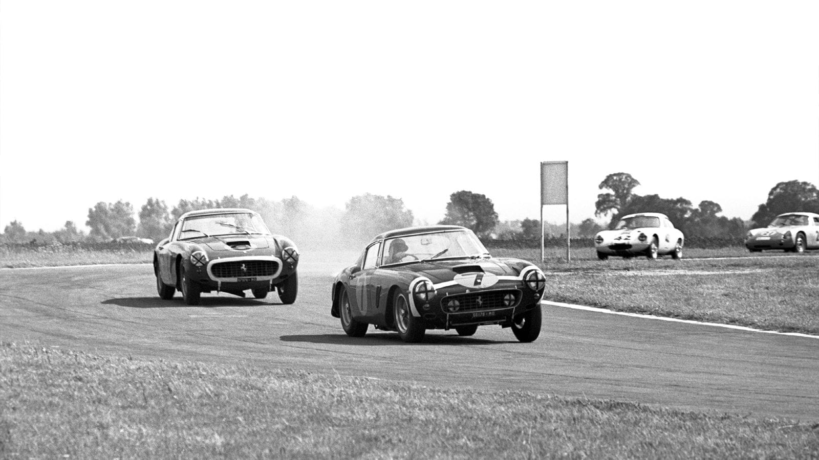 Stirling Moss in a Ferrari 250 GT SWB leads Mike Parkes in the 1961 Tourist Trophy at Goodwood