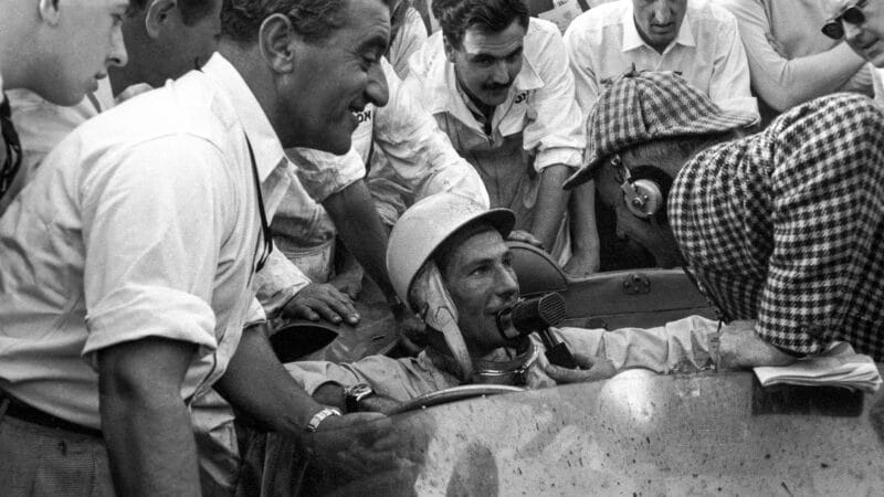 Stirling Moss interviewed in car at Goodwood