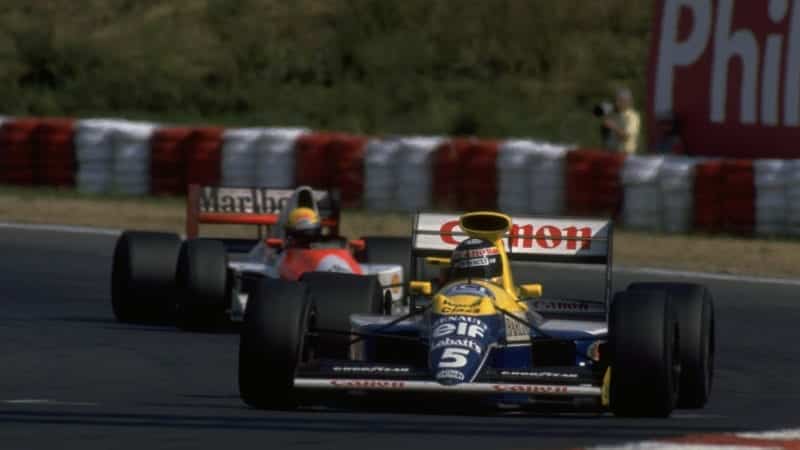 Thierry Boutsen ahead of Ayrton Senna at the Hungaroring during the 1990 Hungarian Grand prix