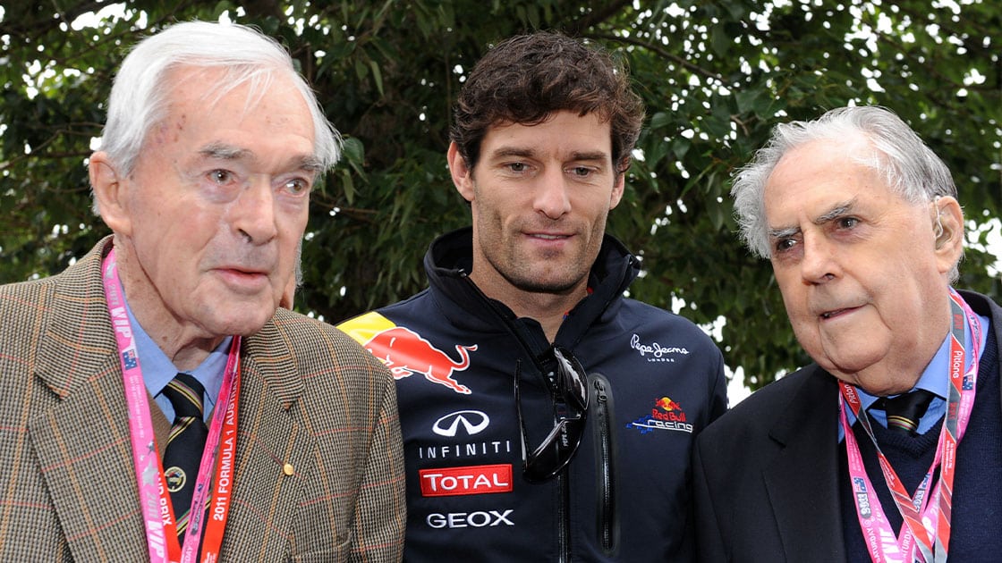 Red Bull-Renault driver Mark Webber (C) of Australia chats with Australia's first Formula One driver and former Spitfire pilot Tony Gaze (L), 92, and compatriot three-time world drivers' champion Jack Brabham (R), on the eve of Formula One's Australian Grand Prix in Melbourne on March 26, 2011. The first race of the 2011 season will be held on the 5.3km Albert Park road circuit on March 27. IMAGE STRICTLY RESTRICTED TO EDITORIAL USE STRICTLY NO COMMERCIAL USE AFP PHOTO / Torsten BLACKWOOD (Photo credit should read TORSTEN BLACKWOOD/AFP via Getty Images)
