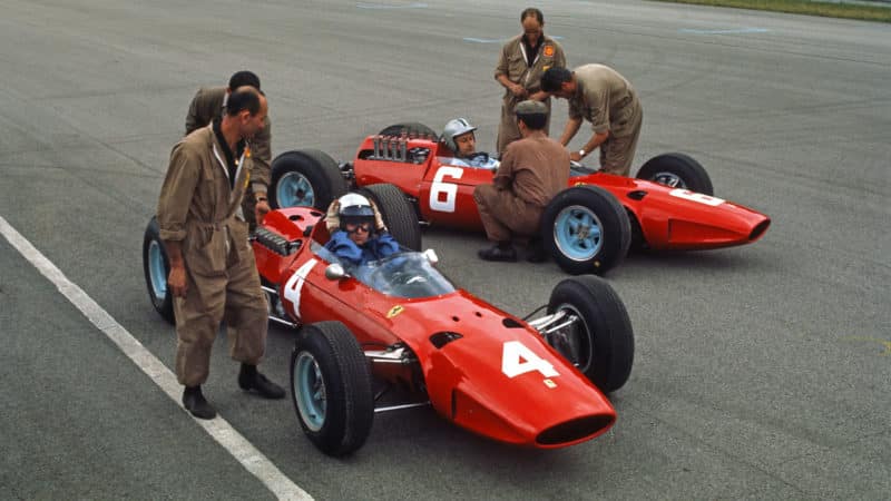 Ferrari drivers Lorenzo Bandini and Nino Vacarella before the 1965 Italian Grand Prix at Monza. Photo: Grand Prix Photo