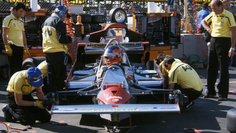 Gilles Villeneuve and Ferrari mechanics in the pits during practice for the 1981 United States Grand Prix in Las Vegas. Photo: Grand Prix Photo