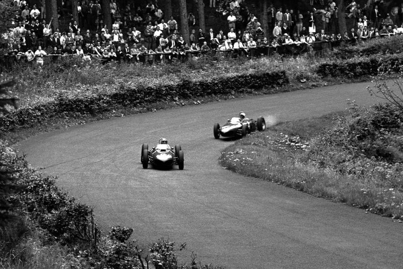 Wolfgang von Trips leads Phil Hill both in Ferrari 156s.