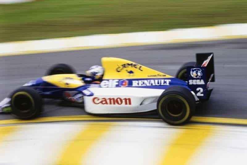 Alain Prost rounds the first corner at 1993 Brazil Grand Prix
