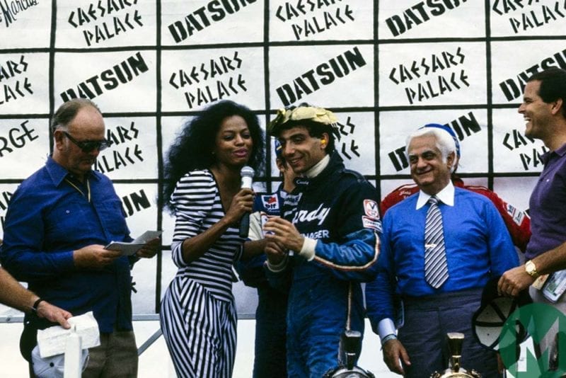 Tyrrell driver Michele Alboreto is congratulated by Diana Ross after winning the 1981 Las Vegas GP