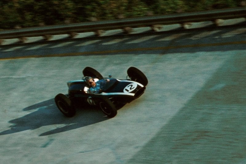 Bruce Mclaren drives his Cooper T55 around the banking.