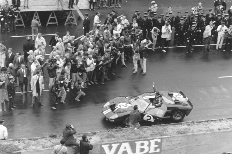 Chris Amon faces the press after taking the Le Mans 1966 win with Bruce McLaren in the Ford GT40 MkII