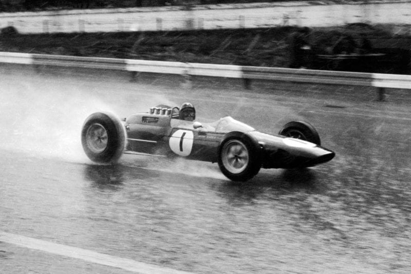 Jim Clark pressing on through the rain in his Lotus 25-Climax.