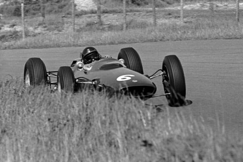 Jim Clark pushing his Lotus 25.