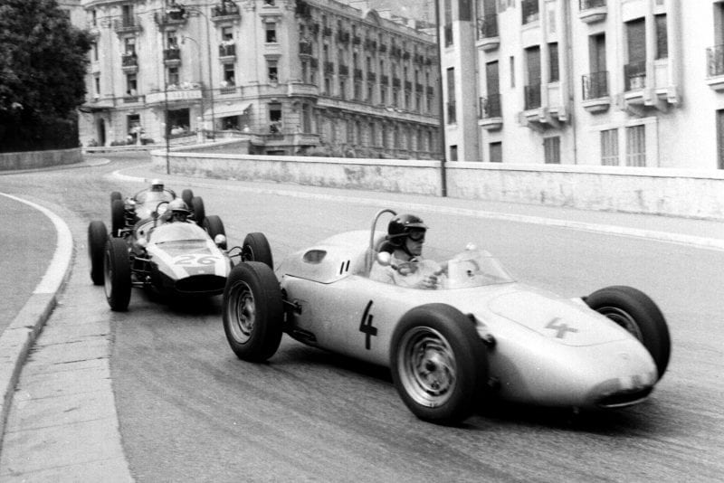 Dan Gurney in a Porsche 718 holds off Bruce McLaren in a Cooper T55 Climax into Station Hairpin.
