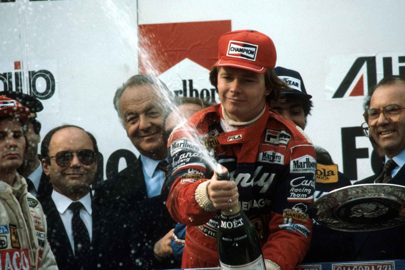 Didier Pironi celebrates on the podium after winning the 1982 San Marino Grand Prix Imola
