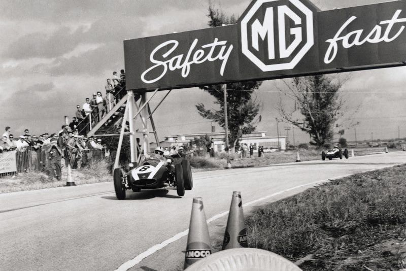 Jack Brabham in his Cooper T51-Climax leads Bruce McLaren also in a Cooper T45-Climax.