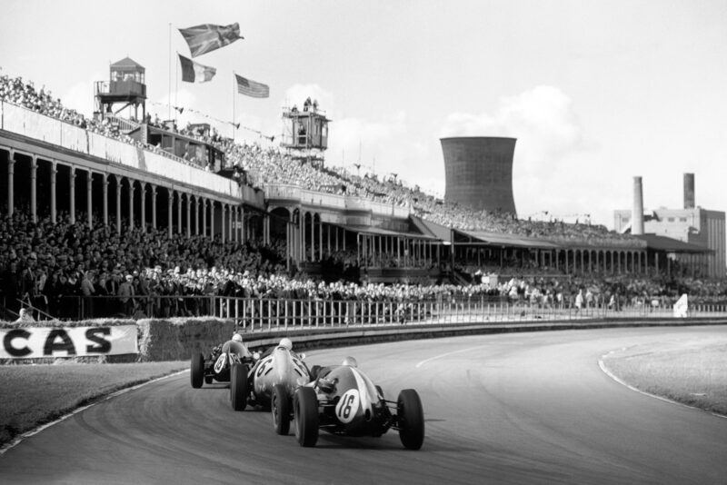 Maurice Trintignant in a Cooper T51-Climax leads Stirling Moss driving a BRM P25 and Bruce McLaren in a Cooper T45-Climax.