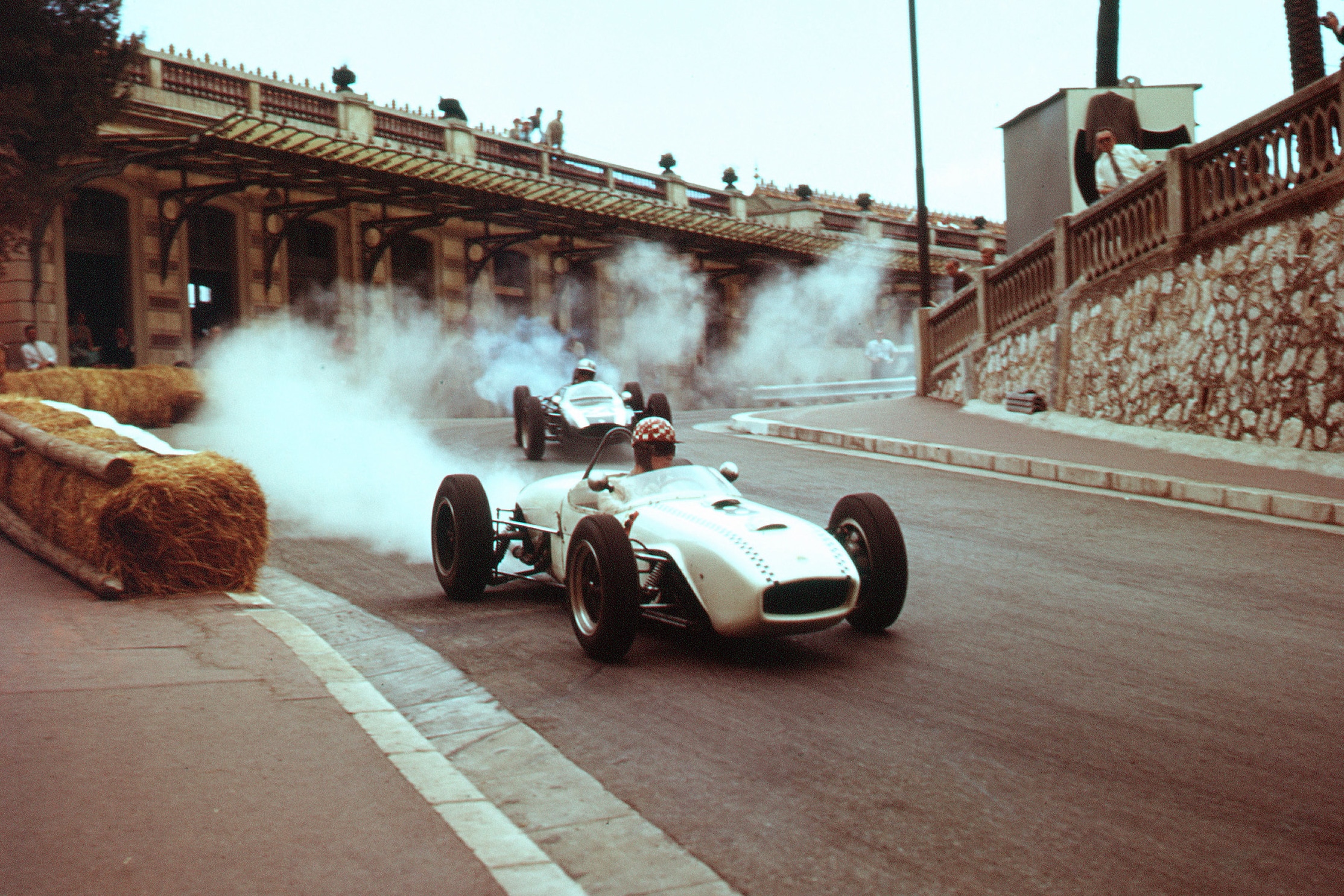Michel May's Lotus 18 Climax retires from the race.