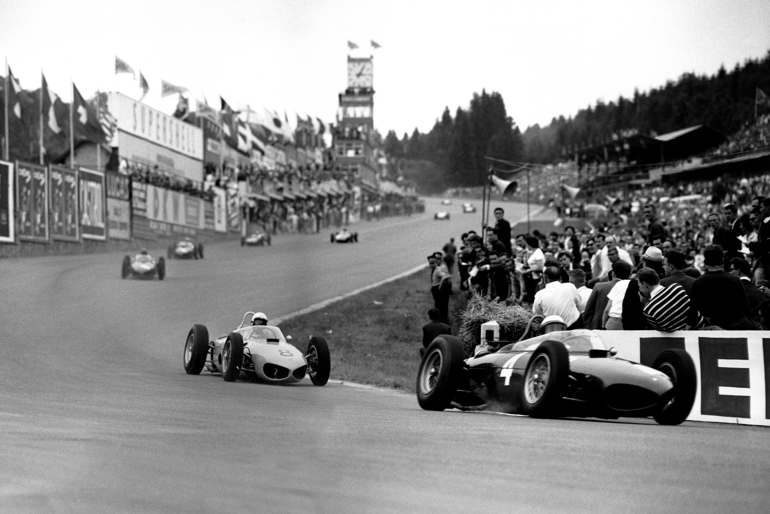 Phil Hill leads Olivier Gendebien, both in Ferrari 156s.
