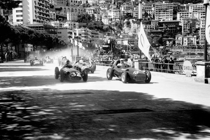 Juan Manuel Fangio (Maserati 250F), 1st position and Stirling Moss (Vanwall VW3), retired, lead at the start of the 1957 Monaco Grand Prix.