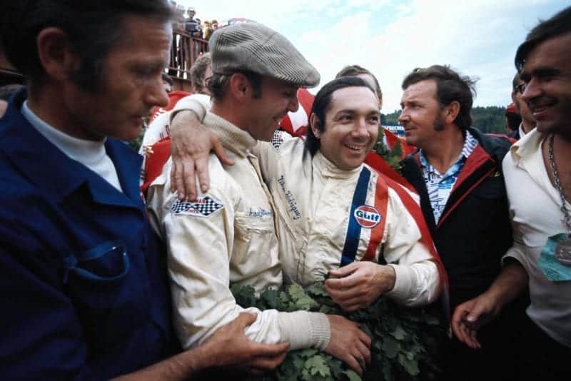 Pedro Rodriguez and Richard Attwood celebrate winning the Austrian 1000km in their Porsche 917