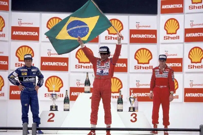 Ayrton Senna on the podium with Riccardo Patrese and Gerhard Berger