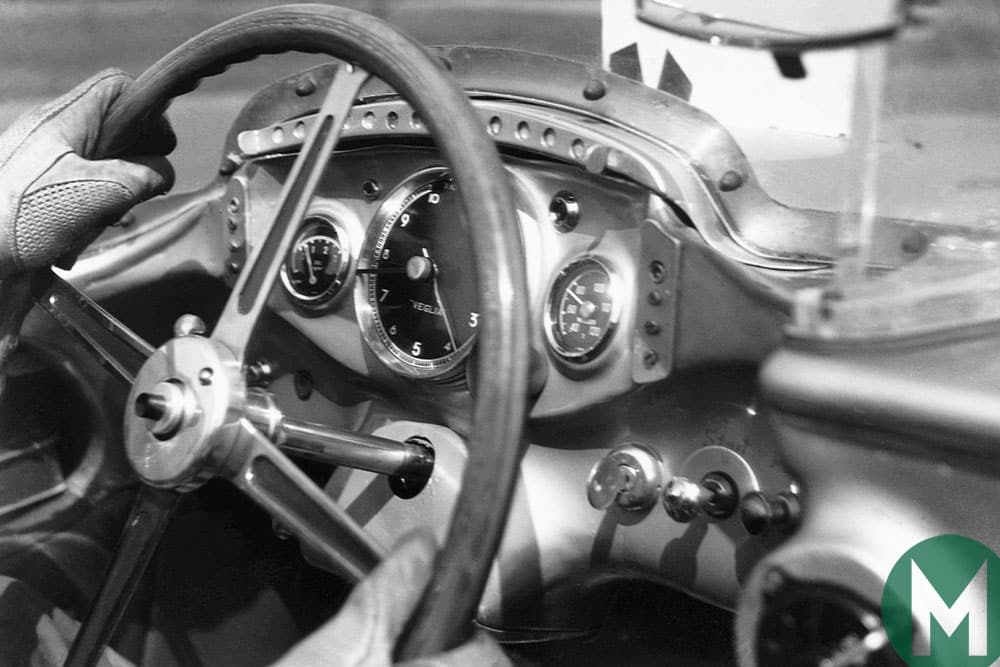 Stirling Moss with hands on the wheel of the Mercedes SLR