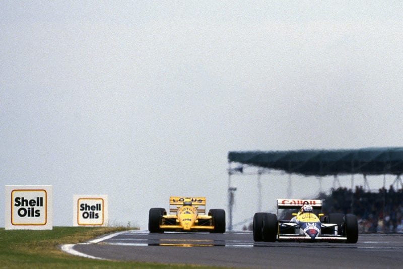 Nigel Mansell, Williams FW11B, leads Ayrton Senna, Lotus 99T.