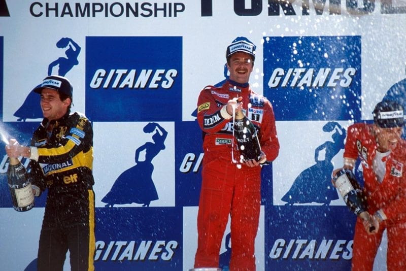 Ayrton Senna, 2nd; Nigel Mansell, winner; Stefan Johansson, 3rd, on the podium.
