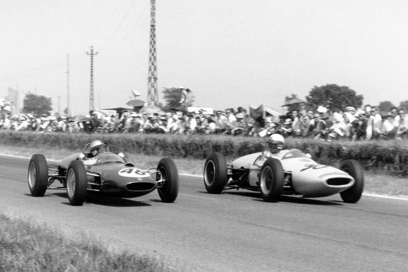 Willy Mairesse in #48 Lotus 21-Climax and Henry Taylor in #30 Lotus 18/21-Climax.