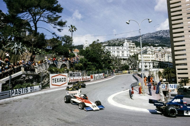 Mark Donahue (Penske) leads Jacky Ickx (Lotus) at Loews during the 1975 Monaco Grand Prix.