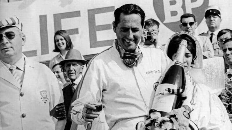 Jack Brabham with champagne after winning the 1966 French Grand Prix