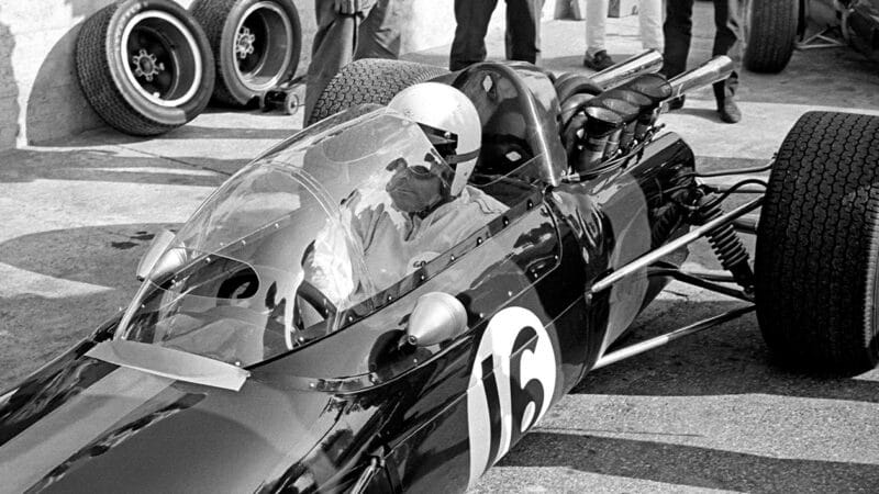 Jack Brabham with streamliner canopy over the cockpit of his Brabham F1 car