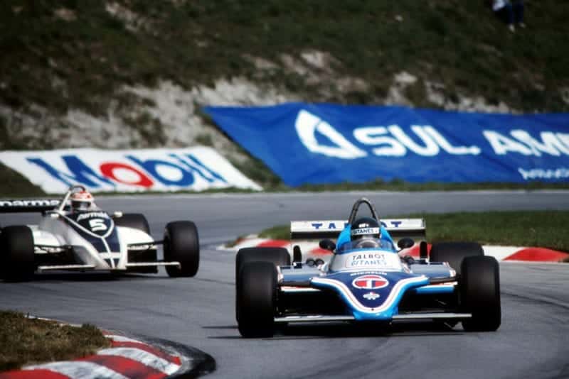 Race winner Jacques Laffite in a Ligier JS17, followed by Nelson Piquet in his Brabham BT49C.