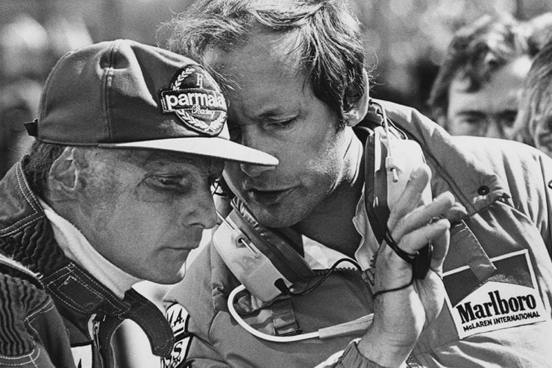 Lauda talks with team boss Ron Dennis.