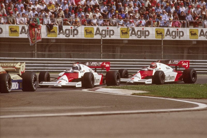 Alain Prostin a McLaren MP42 TAG Porsche racing closely with teammate Niki Lauda.