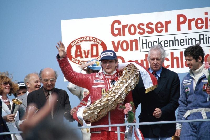 Niki Lauda waves to the crowd after winning the 1977 German Grand Prix, Hockenheim.