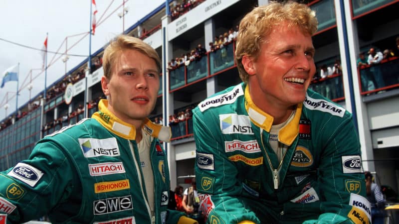Mika Hakkinen with Lotus teammate Johnny Herbert