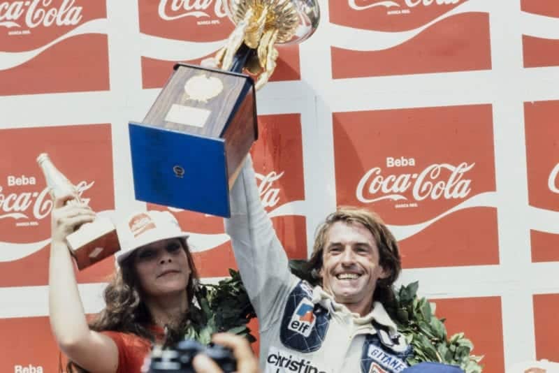 Jacques Laffite (Ligier) celebrates on the podium after winning the 1979 Brazilian Grand Prix.