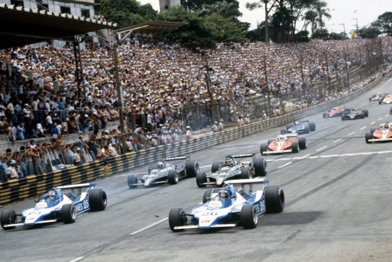 Tyres smoke at the cars pull away at the 1979 Brazilian Grand Prix, Interlagos.