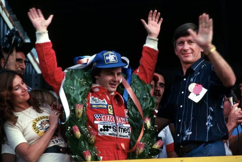 A delighted Gilles Villeneuve (Ferrari) acknowledges the crowd after winning the 1979 South African Grand Prix.