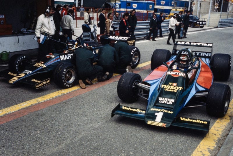 The Lotus team prepare their cars in the pits at the 1979 Spanish Grand Prix, Jarama.