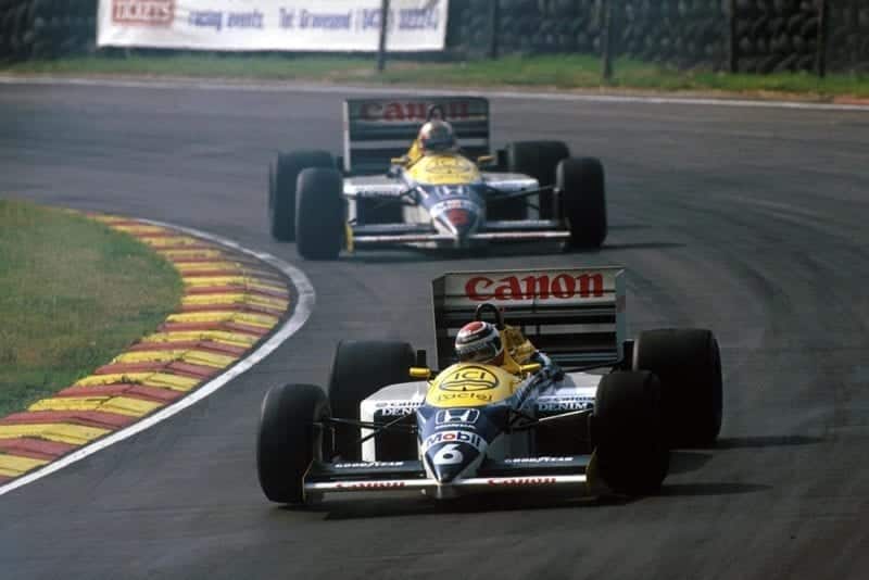 Nelson Piquet (Williams FW11) leads his team mate and race winner Nigel Mansell during an exciting race-long battle for the lead.