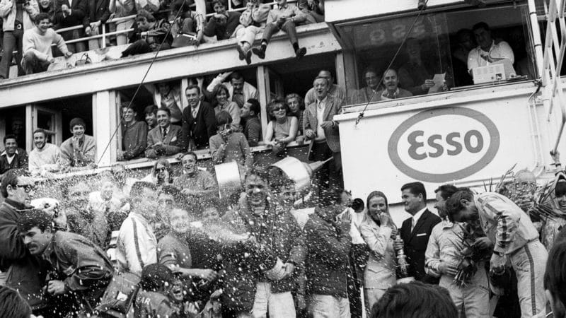 Dan-Gurney-sprays-champagne-on-the-podium-for-the-first-time-at-the-1967-Le-Mans-24-Hours