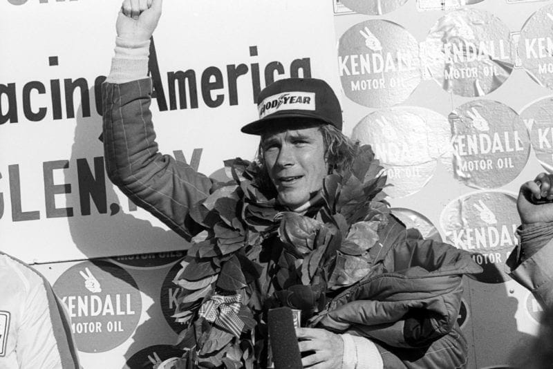 James Hunt (McLaren) celebrates his win on the podium at the 1976 United States Grand Prix East, Watkins Glen.