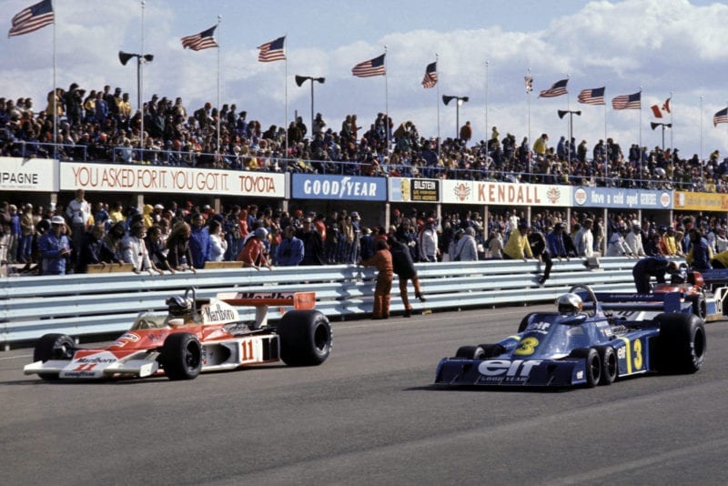 James Hunt (McLaren, left) and Jody Scheckter (Tyrrell, right) line up on the grid at the race start, United States Grand Prix East, Watkins Glen.